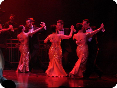 Mansin Tango Show in Buenos Aires dancers in a group choreography with elaborated costumes